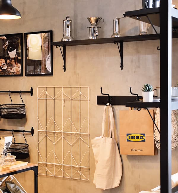 Wall shelves with bags and other decorative pieces are displayed.