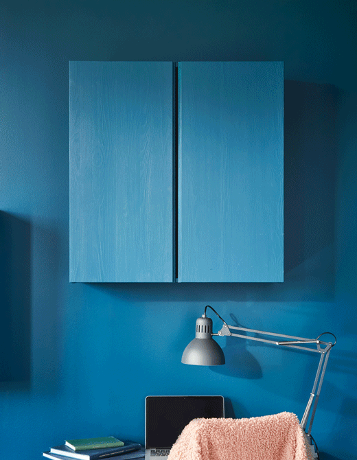 Want DIY wall storage that holds your office supplies nearby while blending in with your room? IKEA can help. Paint a solid pine IVAR cabinet to match your walls. Attach a fibreboard pegboard inside.