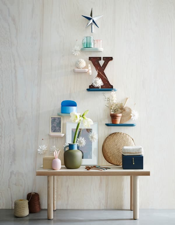 Want new living room decoration ideas this holiday? Go for an artificial Christmas tree as wall décor! Pimp your wall with deco and a star. IKEA has a lot of holiday deco such as VINTER 2017 top star in a glittery silver colour.