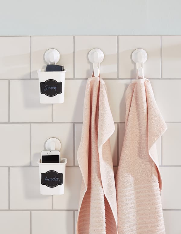 Want suction hooks for your bathroom? White plastic STUGVIK toothbrush holder from IKEA has a suction cup hook and sticks onto glass, mirrors or tiles. Instead of a toothbrush, it can hold your cell phone to keep it from getting wet or dirty. 