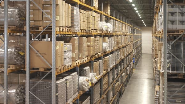 Warehouse shelving full of brown box stock