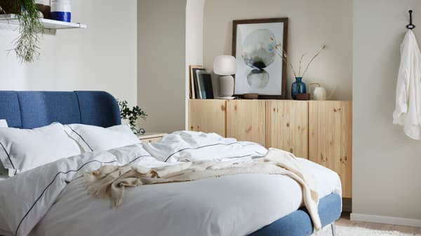Warm, cosy blue IKEA bed