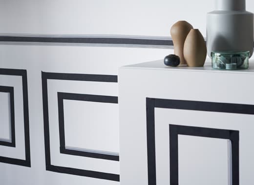 Whatever your thing, you can find affordable furniture tips at IKEA. Decorating a small living room wall with washi tape panels is a great way to do it yourself. Just use IKEA GIVANDE black matt tape that is easy to stick and remove.
