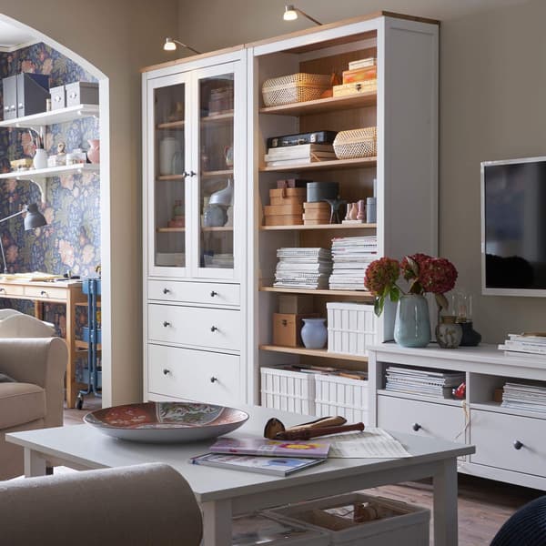 White and birch bookcases in a living room.