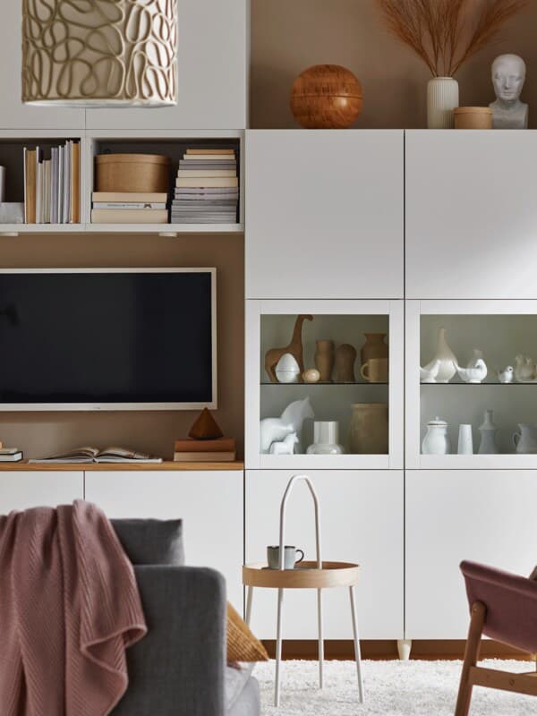 White BESTÅ cabinet with open and closed doors