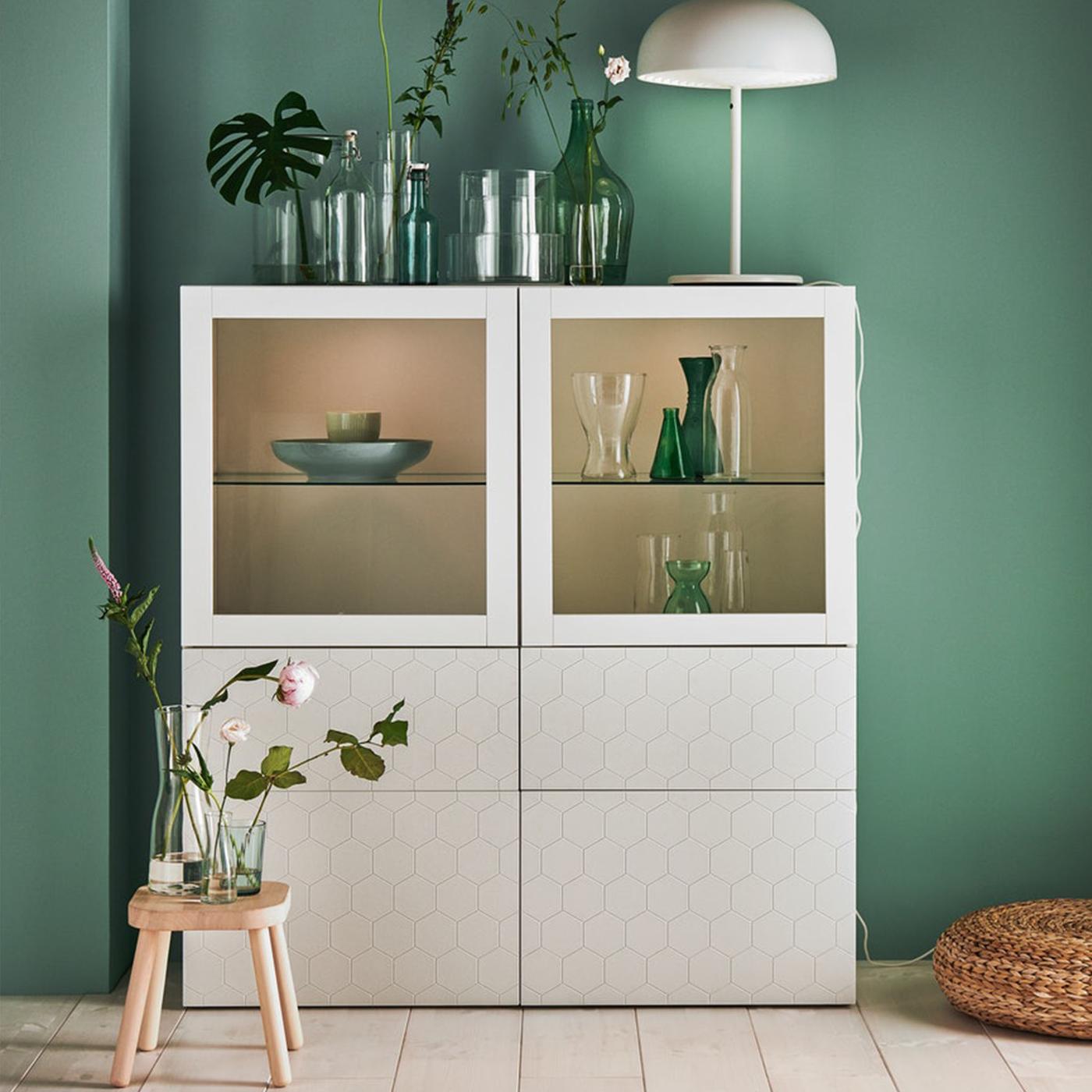 White BESTÅ cabinet with plants and a lamp