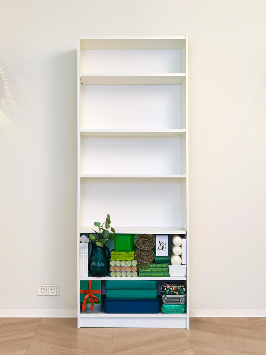 White BILLY bookcase - first two shelves are filled