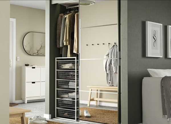 White JONAXEL storage combination in bedroom.