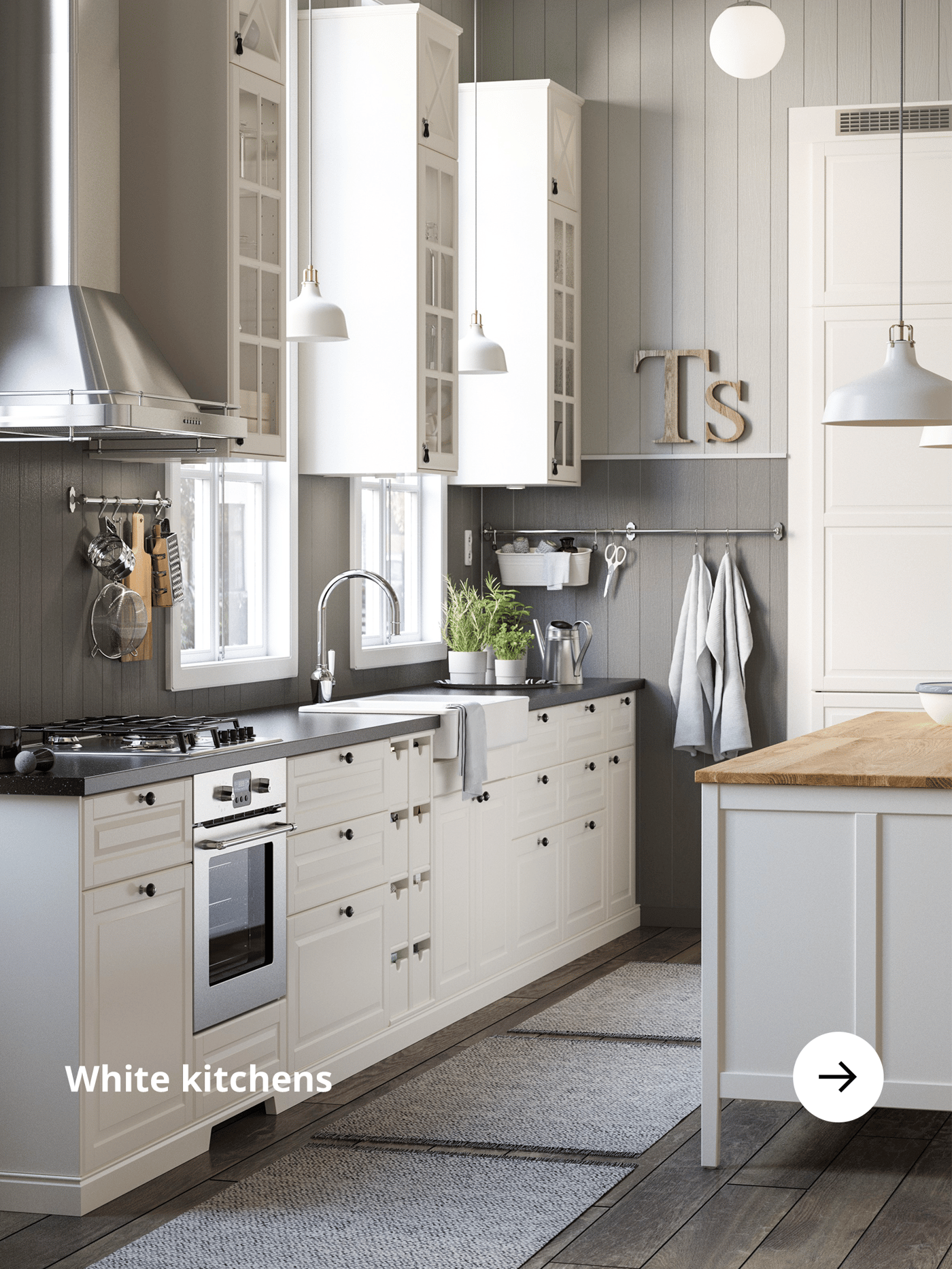 White kitchen with a silver extractor hood.