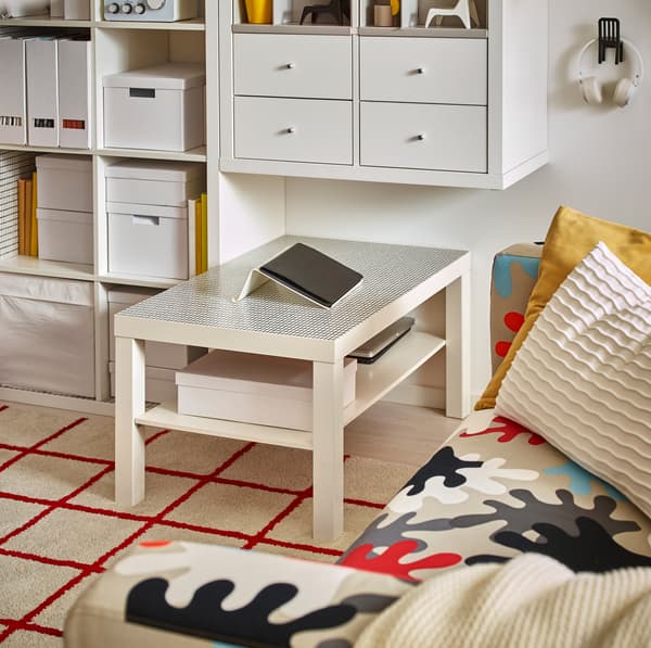 White LACK coffee table with a black grid-patterned table surface.