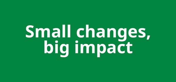 White letters on a green background that read small changes big impact