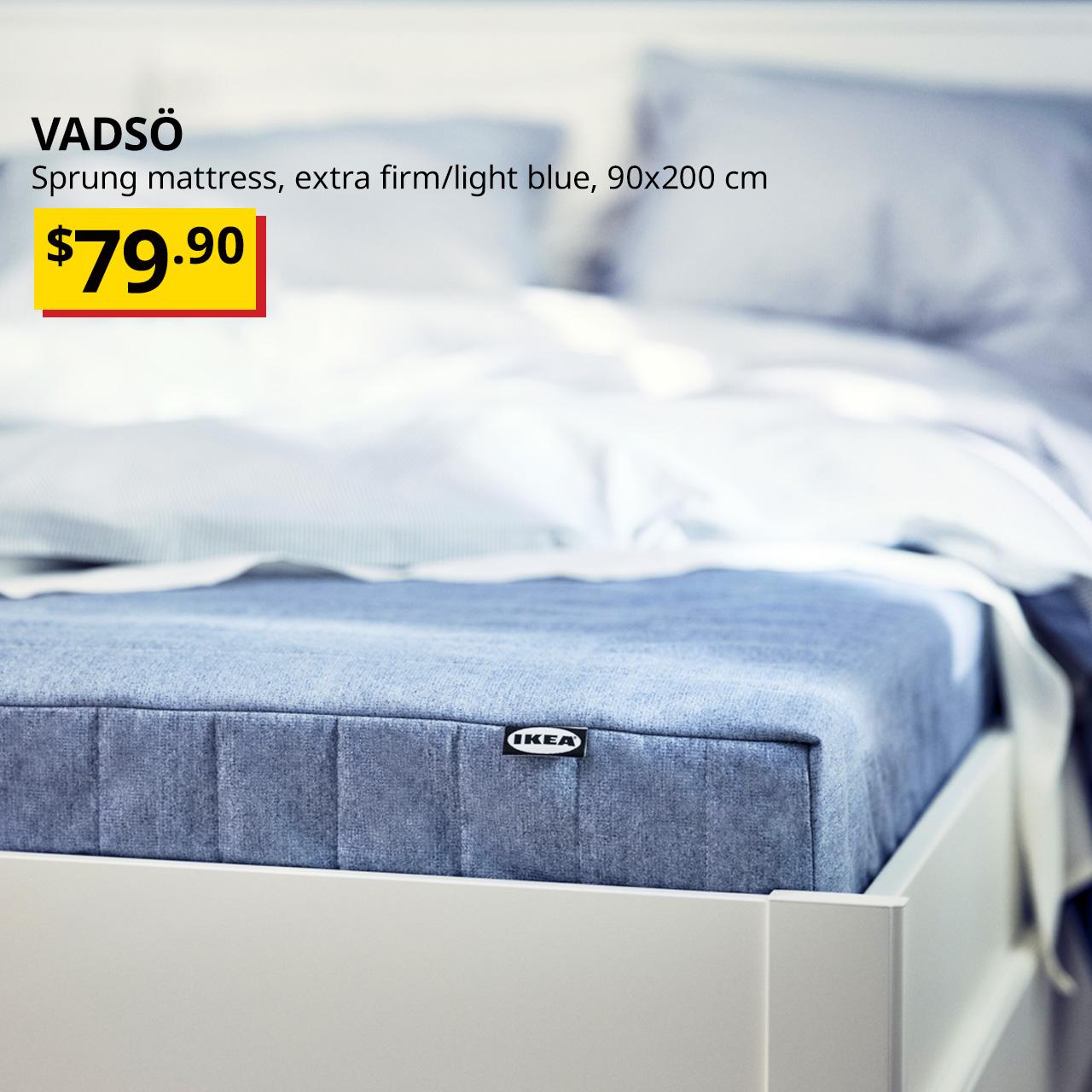 White MALM bed frame shows VADSÖ sprung mattress, extra firm/light blue, 90x200 cm Price: $79.90