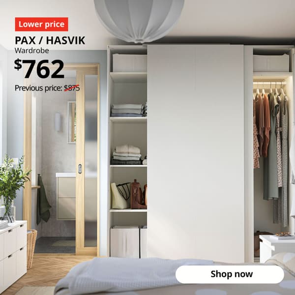 White PAX / HASVIK wardrobe combination in bedroom setting. 20% off PAX wardrobe doors & KOMPLEMENT interior organisers. Lower price tag. $762, previous price $875.