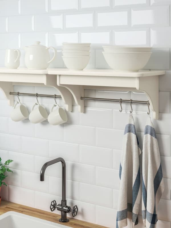 White wall shelves with matching dek cups and bowls.