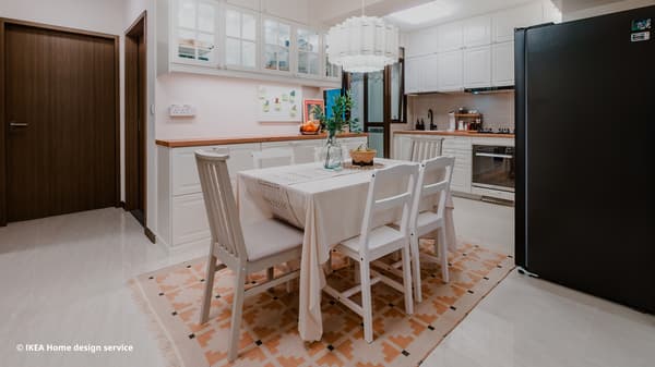 Wide shot of dining area featuring extendable NÄSINGE dining table, HAUGA and NÄSINGE chairs from a traditional modern 4-room BTO flat in MacPherson, Singapore, designed by IKEA Home design service.