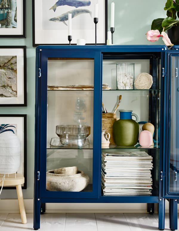 With a glass-door cabinet you can show off as well as protect your glassware or your favourite collection. IKEA has a wide selection of cabinets such as FABRIKÖR glass-door cabinet in blue. You can easily change the height of the shelves.