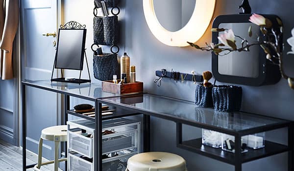 With the help of a narrow table, two stools, some organisers, trolleys and a lighted mirror you can make a hair and makeup station.