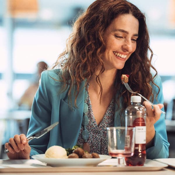 Woman eating in an IKEA restaurant