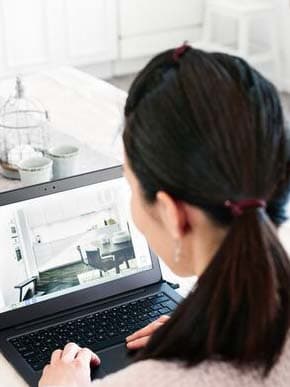 Woman laptop in bright room