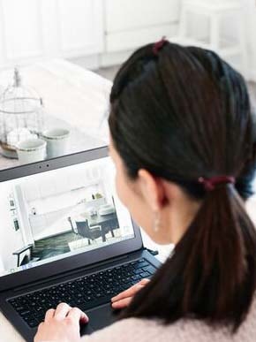 Woman laptop in bright room