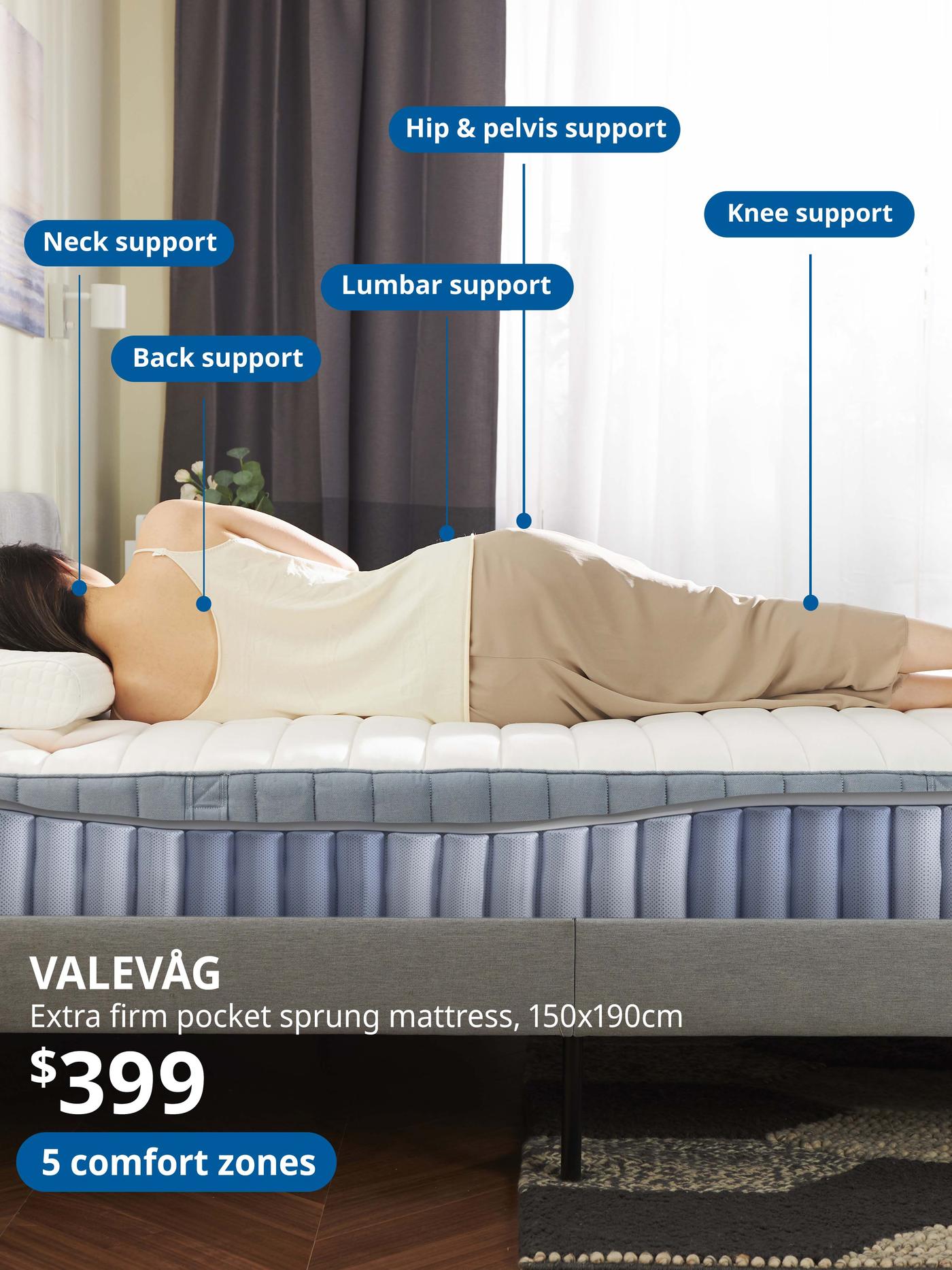 Woman lying on VALEVÅG Pocket sprung mattress, extra firm/light blue, 150x190 cm. Price: $399. 5 comfort zones.