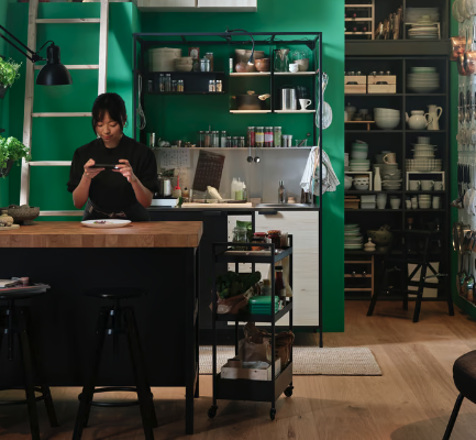 Woman photographing her food in kitchen