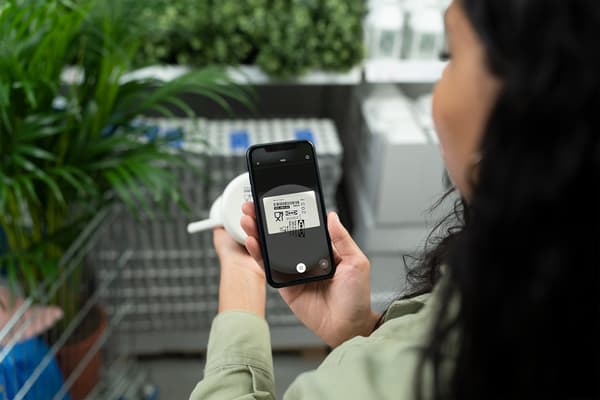 woman scanning a product with the ikea app on her phone 