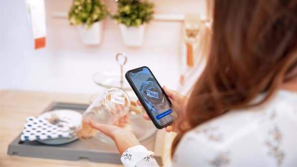 Woman scanning a reference on a product with the IKEA app