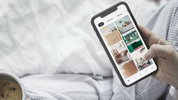 Woman using a smart phone in an IKEA store