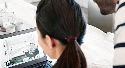 Woman using IKEA planning service on laptop