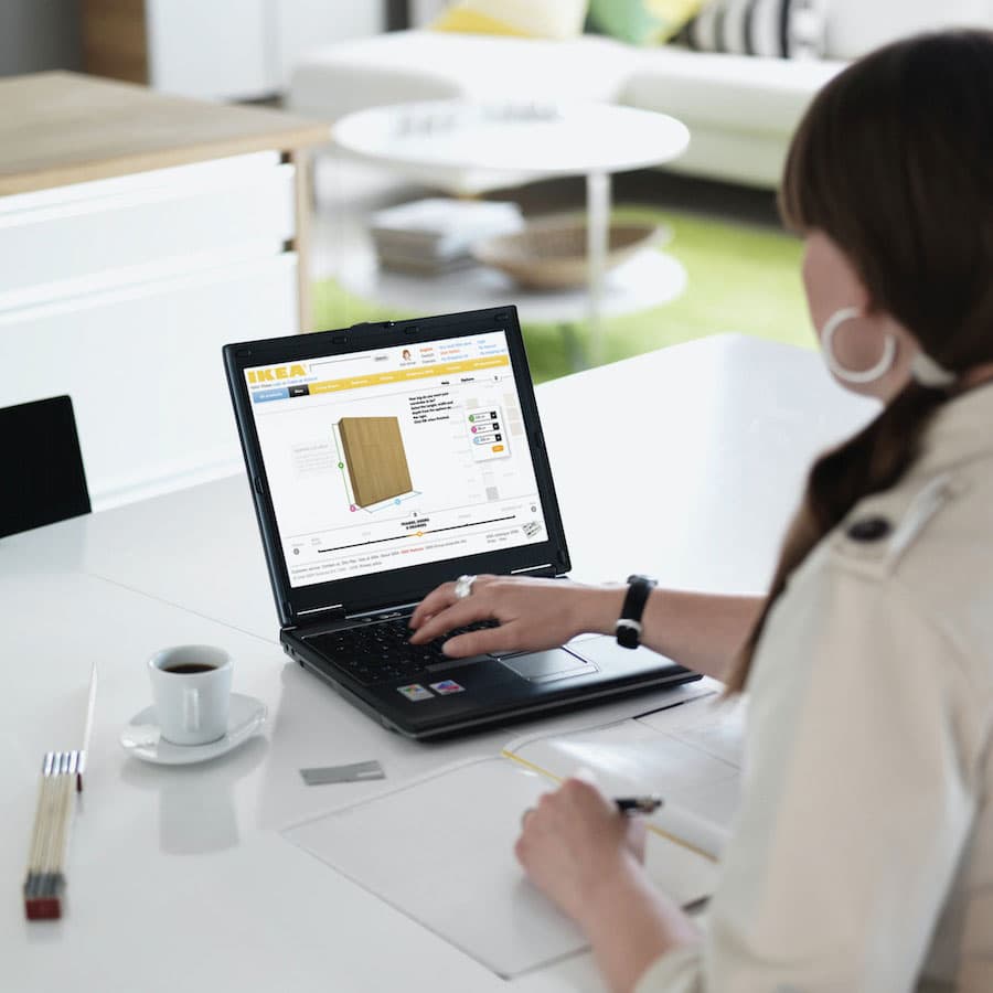 Woman using online planner on their laptop