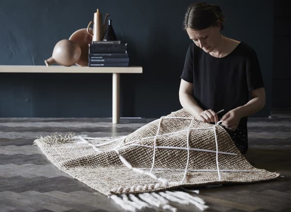 Woman with a LOHALS jute rug.