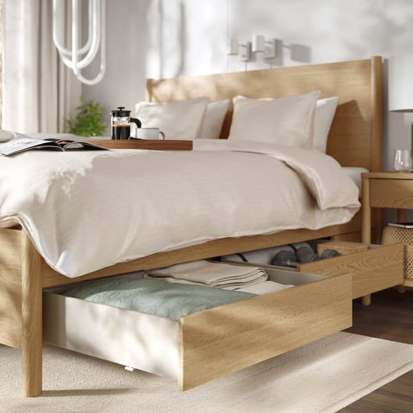Wood bed with storage drawers.