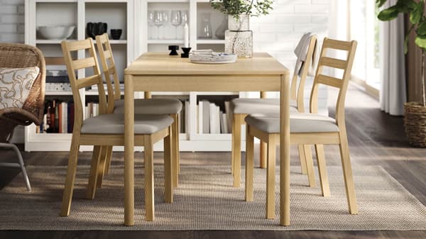 Wooden dining table with chairs.