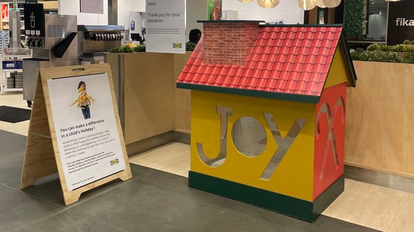 Wooden donation house in front of the IKEA Bistro