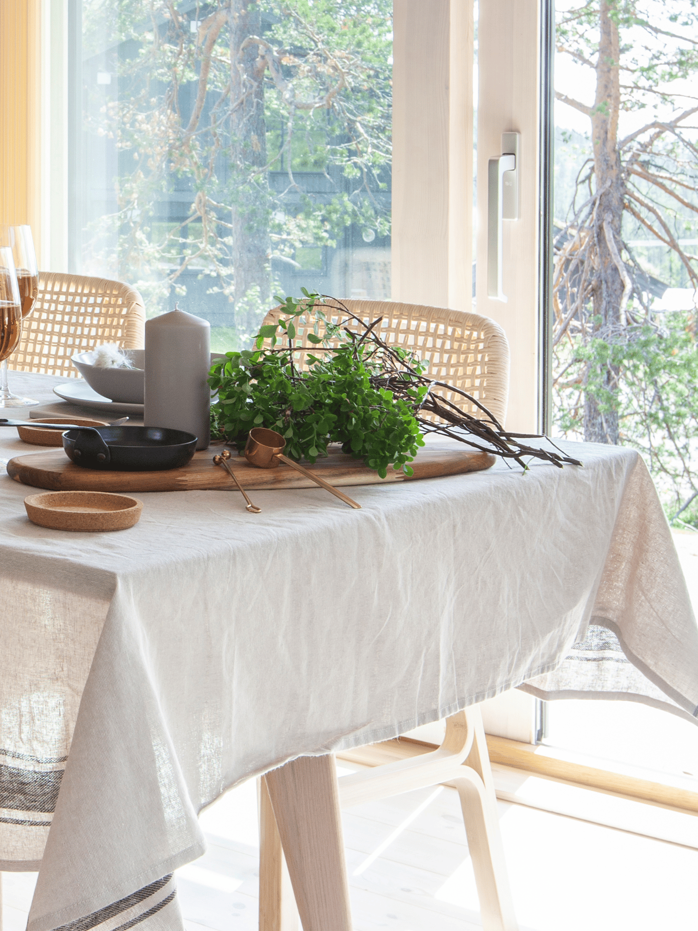 Wooden table and chairs with a linen table cloth