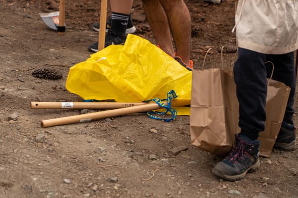Yellow IKEA bag on the floor with planting tools
