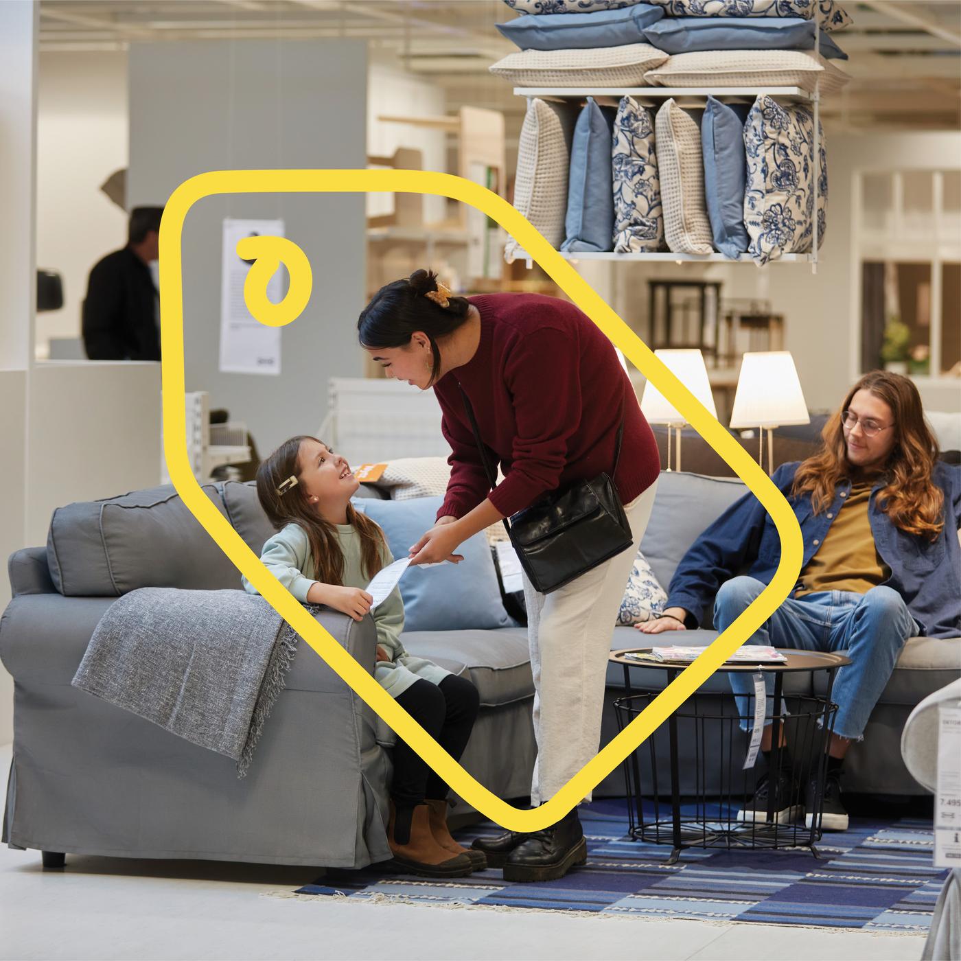 Yellow line discount symbol overlaid on an image of people shopping.