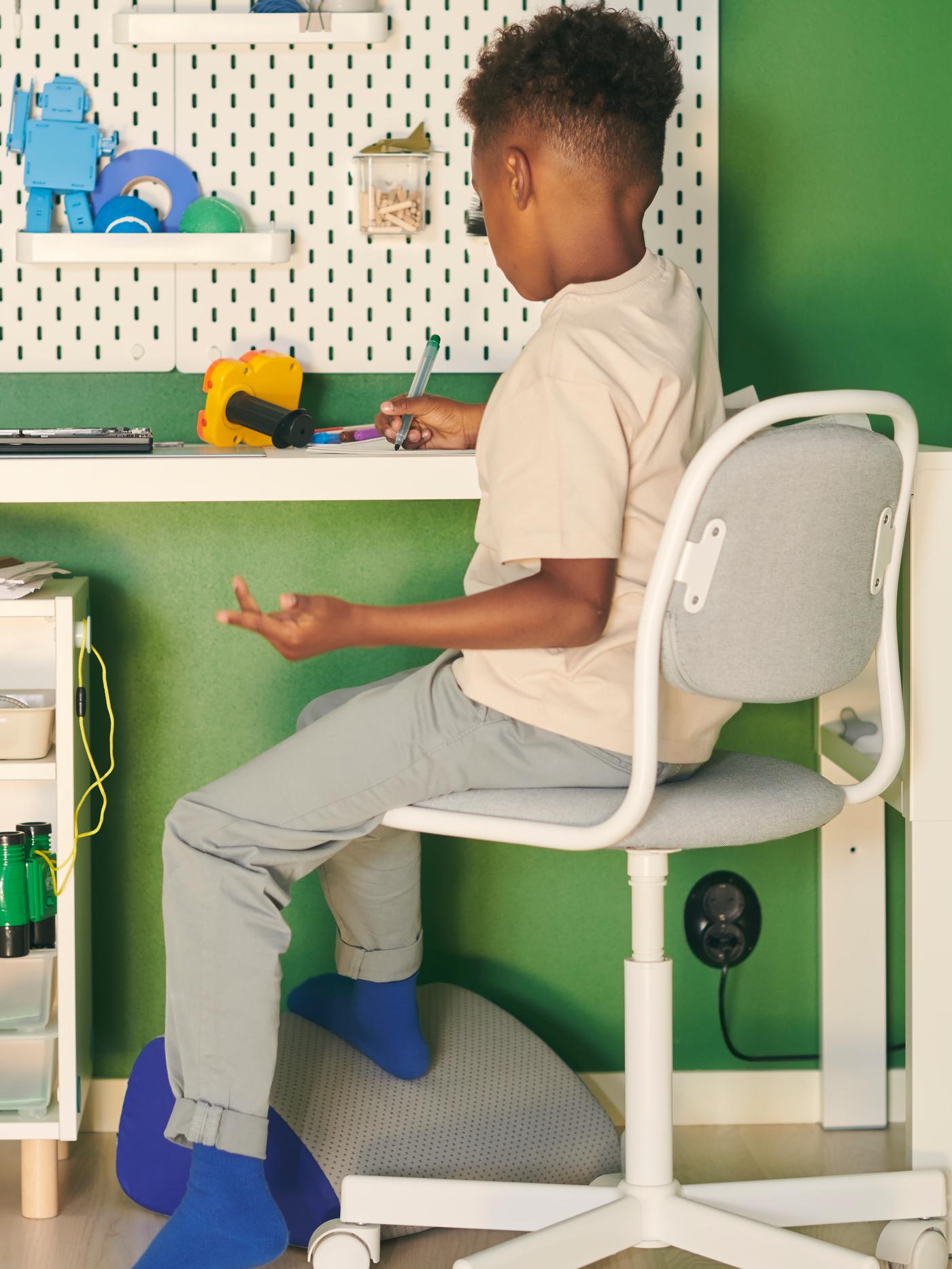 young child sitting at desk