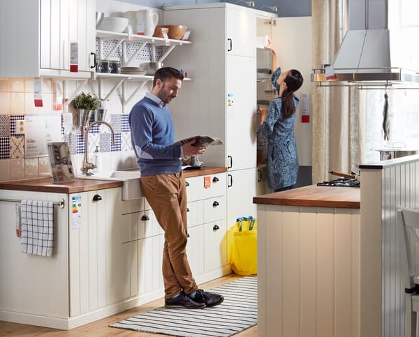 Young couple in a kitchen showroom