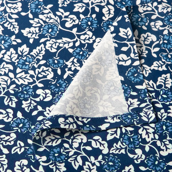 Floral blue bedsheet detail, showcasing quality stitching and soft fabric blend.