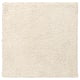 A square, ivory-colored, shaggy arende area rug with soft texture.