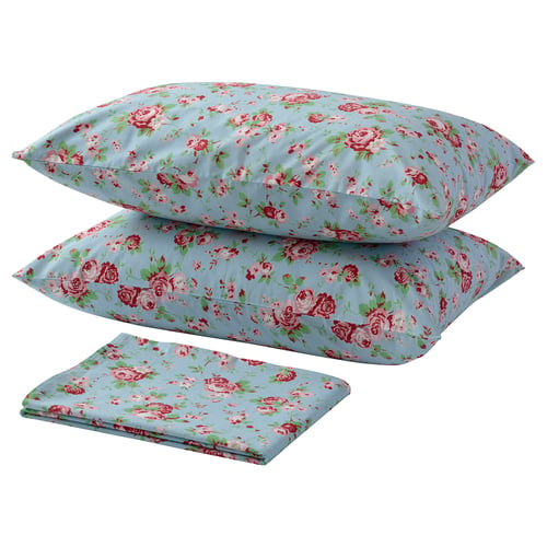 A set of blue floral bed linens: 2 pillows, 1 fitted sheet. Floral pattern with red roses on light blue.