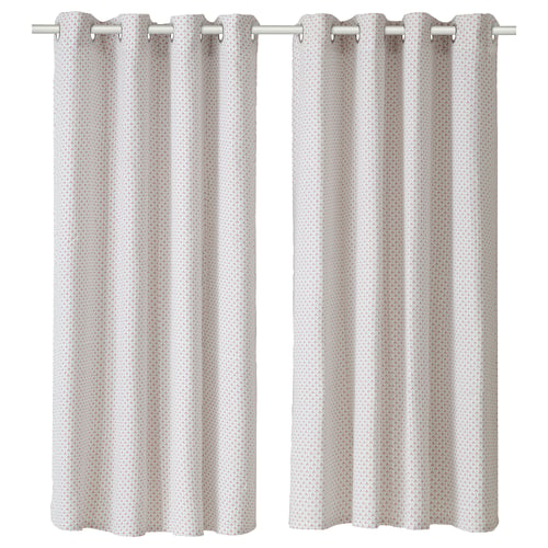 Two light-colored curtains with subtle patterns hanging side by side.