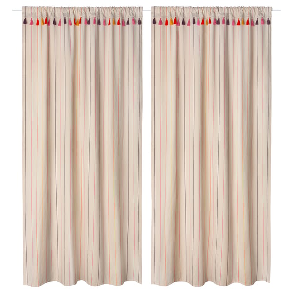 Two beige striped curtains with colourful tassels at the top, made of 100% cotton, hanging on a white rod.