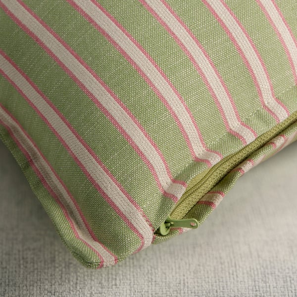 Green and pink striped cushion cover with a zip, perfect for a sofa or bed.