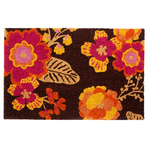The AROMATISK doormat vibrant flowers against a dark background. The rectangular shape is made of coir, offering a colourful welcome to any entrance.