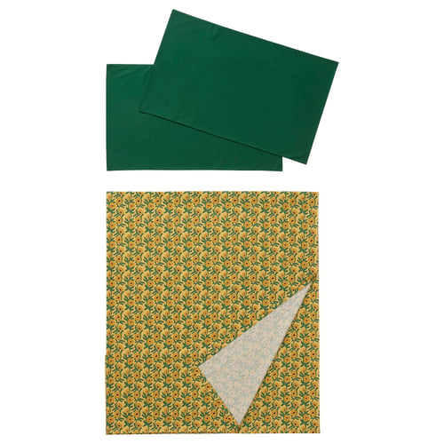 Two green rectangular fabrics shown, one with floral yellow and green print. Both made of 100% cotton.