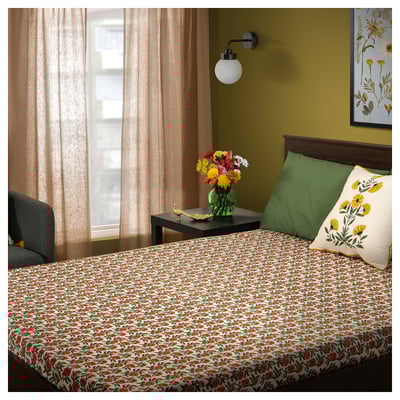 AROMATISK green bed set with floral print on white sheet, green pillows. Soft cotton, vibrant, fresh look.
