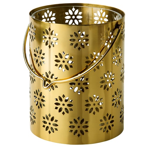 Golden metal lantern with floral cutouts. Round with handle, decorative and festive for ambiance.